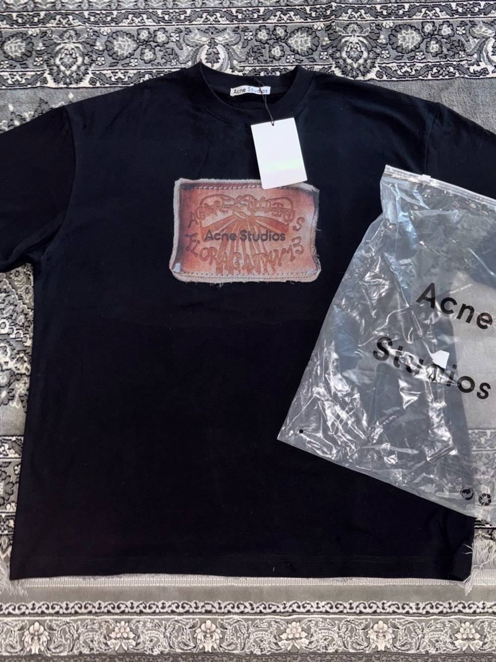 Acne black tee with brown leather-look logo patch